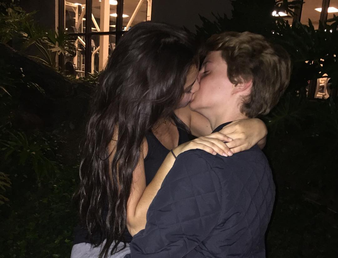 Goth breasting boyfriend hugging kissing over fan photos
