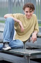 Jonathan Brandis : YellowShirtSitting.jpg